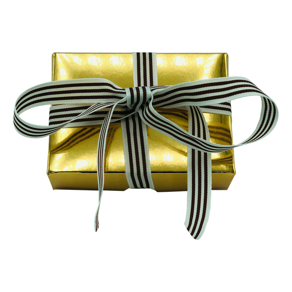 Golden Gift box containing two pieces of handmade fudge wrapped in a bow